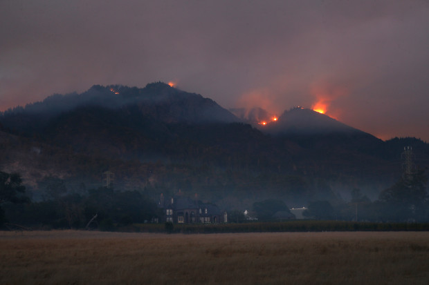 Fire burns on Sugarloaf Mountain behind the Ledson Winery in Santa Rosa, California, late Sunday, October 15, 2017. (Karl Mondon/ Bay Area News Group)